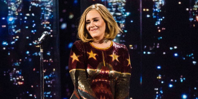 Adele performing on stage - helps a fan propose