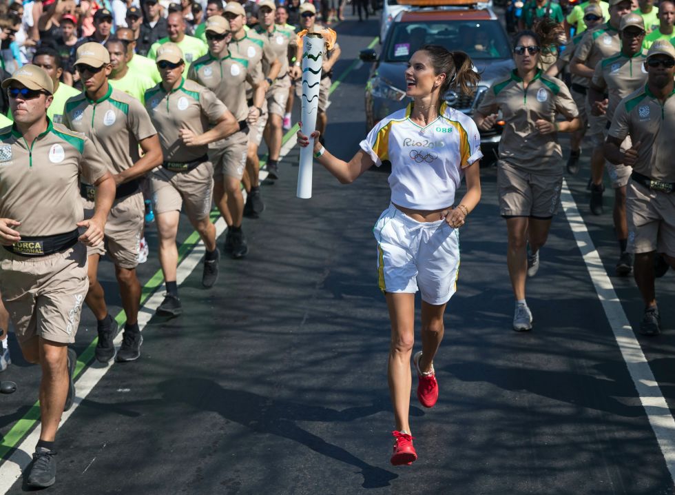 The Brazilian model and Victoria's Secret Angel Alessandra Ambrosio carries the Olympic torch through Rio.
