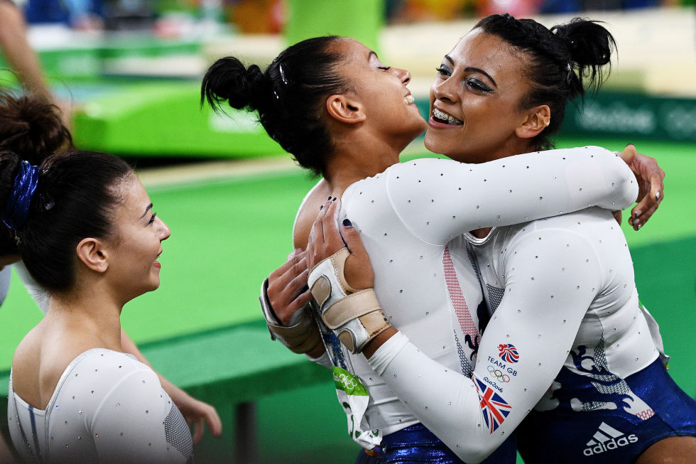 Day four: Ellie and Rebecca Downie hug after competing on the vault during the Artistic Gymnastics Women's Team Final. 
