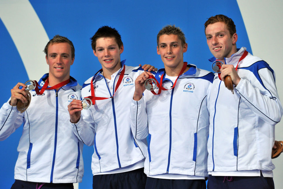 Day four: Silver medallists Daniel Wallace, Stephen Milne, Duncan Scott and Robbie Renwick pose during the Men's 4x200m Freestyle Relay medal ceremony.
