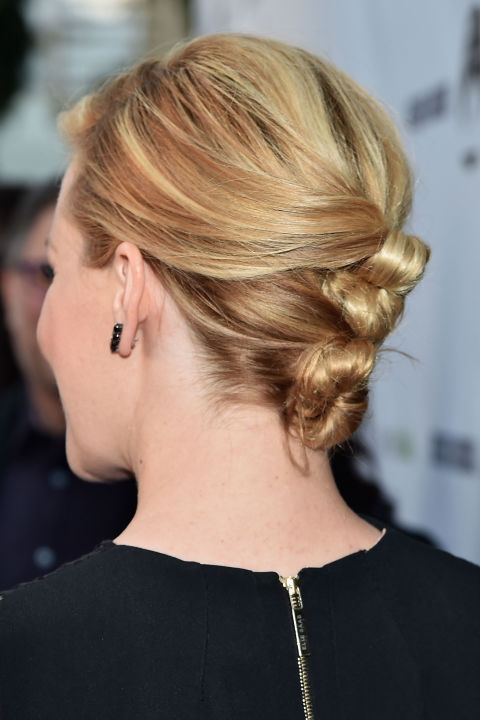 Separate hair into sections and twist into knots at the back of the head for a contemporary take on a chignon. 
