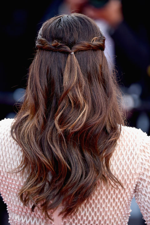 Simply twist hair from the front of the head and fix at the back to copy this pretty half-up, half-down look. 
